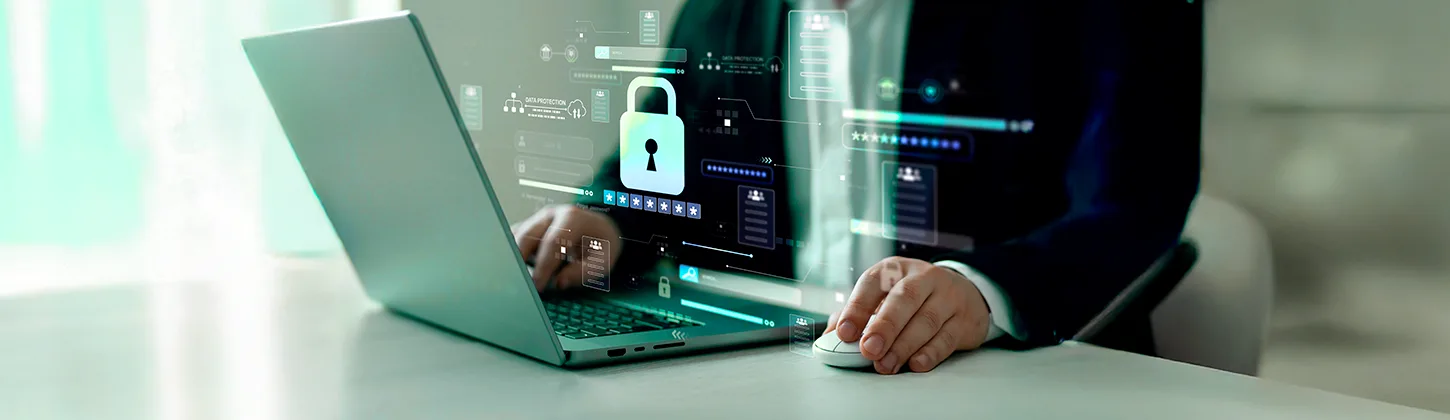 Uma pessoa em um terno usa um laptop com uma interface digital sobreposta que exibe um grande cadeado, campos de login e outros gráficos de segurança. A imagem ilustra a tecnologia de proteção de dados, destacando a necessidade da Autenticação Multifator para garantir a segurança no acesso a sistemas.