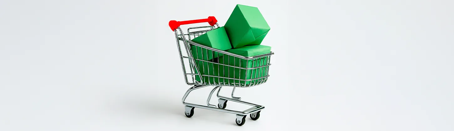 Um carrinho de compras está cheio de caixas verdes. A imagem simboliza o alto volume de transações e a necessidade de gerenciar os contratos de Black Friday decorrentes das compras de grande escala.